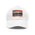 White baseball cap with light brown patch inspired by Aston Martin aesthetics.