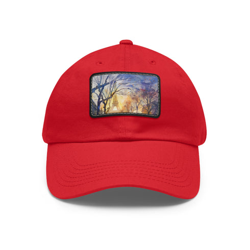White Eiffel Tower watercolor baseball cap with light brown patch.
