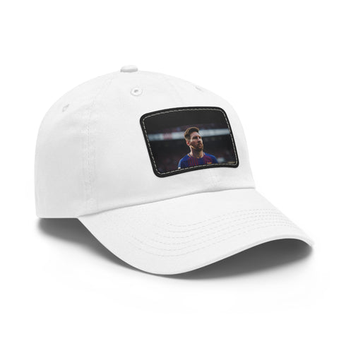 White cotton baseball cap with light brown patch and Lionel Messi logo.