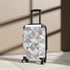 Chic pastel geometric small black suitcase, perfect for stylish travelers.