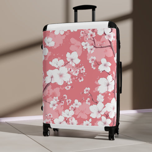 Cherry blossom small black travel suitcase with pink and white pattern.