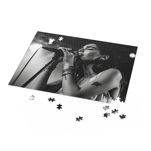 Vibrant puzzle featuring Dua Lipa in a singing moment for fans.