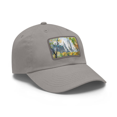 Central Park watercolor baseball cap with light brown patch.