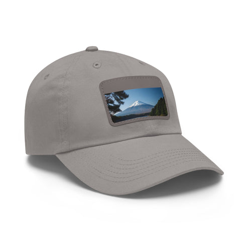 White baseball cap with light brown patch featuring stunning Mount Fuji design.