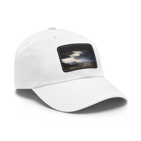White baseball cap with light brown patch featuring Icelandic Adventure.