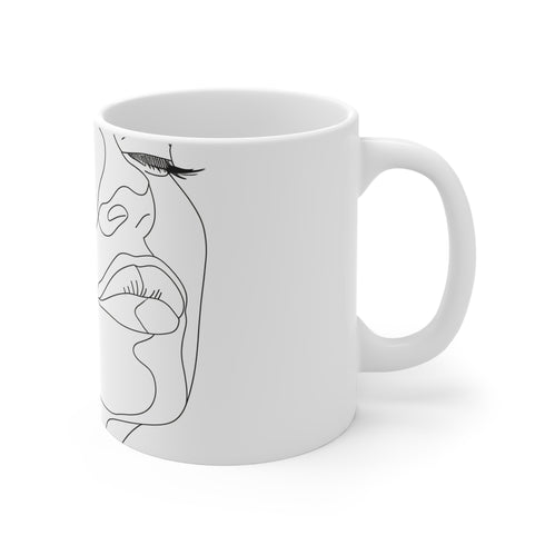Chic minimalist black and white ceramic face coffee mug.