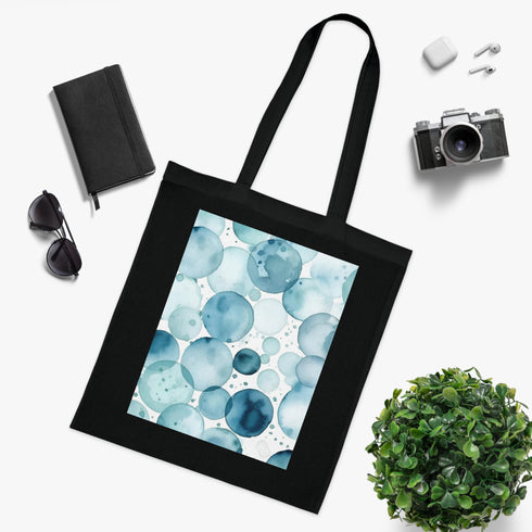 Stylish black cotton tote bag with mesmerizing ocean gaze eye pattern.