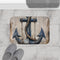 Nautical anchor bath mat with coastal charm for bathroom decor.