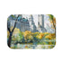 Central Park Oasis Bath Mat with serene watercolor nature scene.