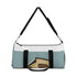 Light blue retro camper duffel bag for weekend getaways.