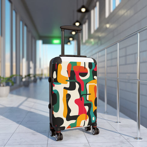 Abstract adventure suitcase set in bold, vibrant colors and modern patterns.