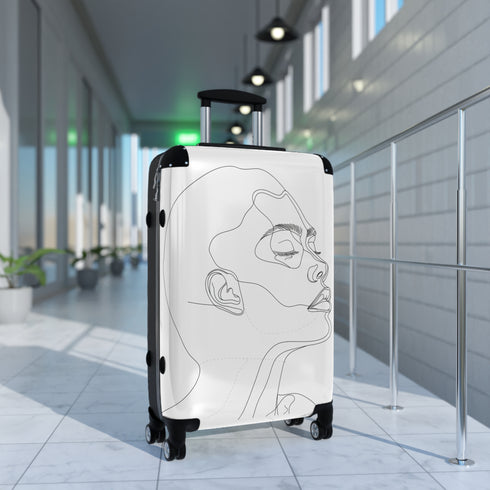 Chic black minimalist face suitcase for travel accessories.