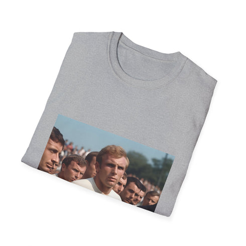 Vintage-style 'A Captain's Legacy: The Spirit of '66' T-shirt featuring Bobby Moore, England's 1966 World Cup-winning captain. Embrace the historic triumph with this captivating design that exudes sporting glory and national pride. Feel the roar of the crowd and the weight of the nation's hopes with every wear. A timeless piece of footballing history to cherish and wear close to your heart.