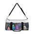 Bohemian feather duffel bag with all-over print design.