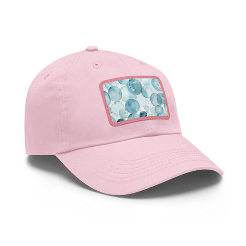 White baseball cap with light brown patch feat. blue water pattern.