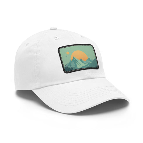 Minimalist white baseball cap with mountain landscape patch for outdoor enthusiasts.