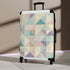 Chic pastel geometric small black suitcase set for stylish travel.