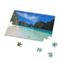 Vibrant Maya Bay jigsaw puzzle featuring crystal-clear waters, lush greenery cliffs.