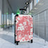 Small black cherry blossom suitcase for stylish travel enthusiasts.