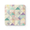Chic pastel geometric coaster set for stylish kitchen and desk.