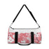 Cherry blossom print small duffel bag with pink and white pattern.
