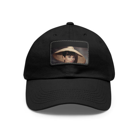Audrey Hepburn monochrome baseball cap with light brown patch.
