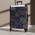 Colorful Firework Fiesta pattern on small black suitcase for travel accessories.