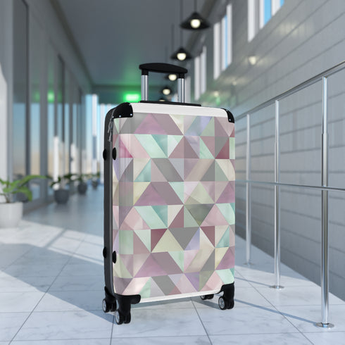 Pastel geometric pattern travel suitcase in small black size.