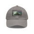 Stylish white cotton cap with Atlantis-inspired light brown patch.