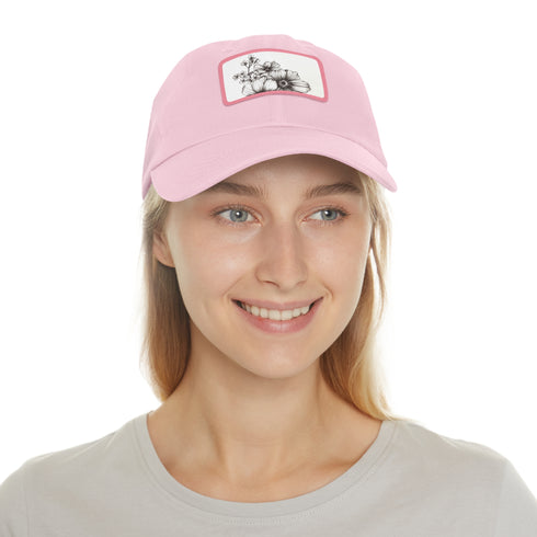 Hand-drawn white floral baseball cap with light brown patch.