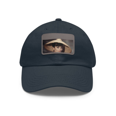 Audrey Hepburn monochrome baseball cap with light brown patch.