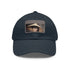 Iconic Audrey Hepburn monochrome baseball cap with light brown patch.