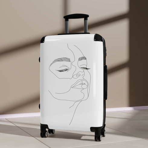 Chic minimalist black small suitcase with face-inspired design for stylish travelers.