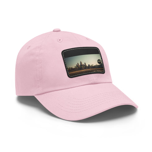 Angkor Wat tribute cap in white with light brown patch.