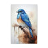 Blue bird perched on tree branch against serene sky canvas.