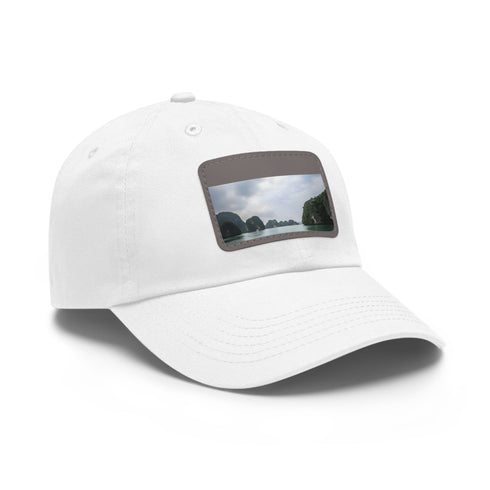 White cotton baseball hat with light brown rectangular patch Halong Bay design.