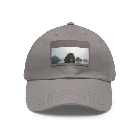 Halong Haven baseball cap in white with light brown patch.