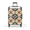 Artisan black suitcase with stylish tiles pattern for minimalist home decor.