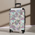Chic pastel geometric small black travel suitcase.