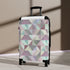 Chic pastel geometric small black suitcase for travel accessories.