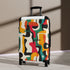 Abstract Adventure Suitcase Set in bold, bright geometric patterns, small and black.