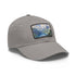 Swiss Alps watercolor baseball cap, white with light brown patch.