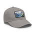 Swiss Alps watercolor baseball cap, white with light brown patch.