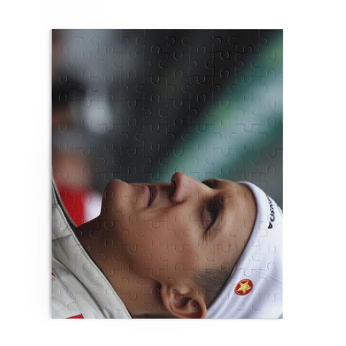 Challenging Michael Schumacher jigsaw puzzle with iconic Formula 1 moments.