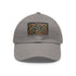 Elegant Celtic knot design white hat with light brown patch.