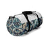 Artisan tile duffel bag with seamless mosaic pattern for chic travel.