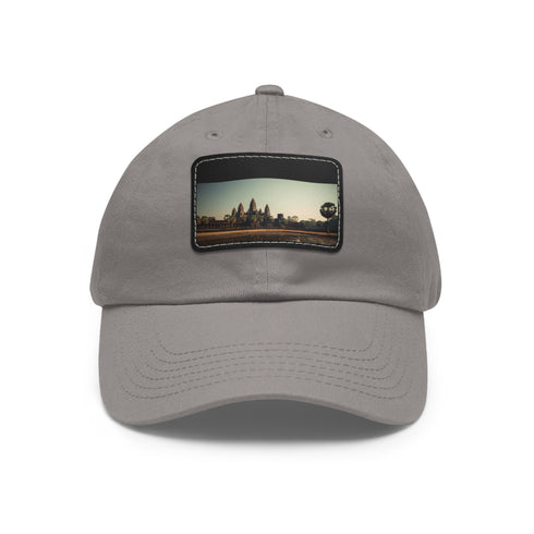 White cotton baseball cap with intricate Angkor Wat inspired designs.