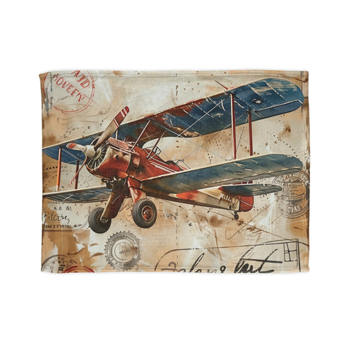 Vintage travelogue airplane blanket with ticket-inspired design in 30'' x 40''.