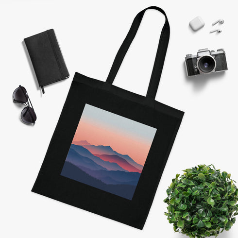 Modern black cotton tote bag with mountain peaks design.