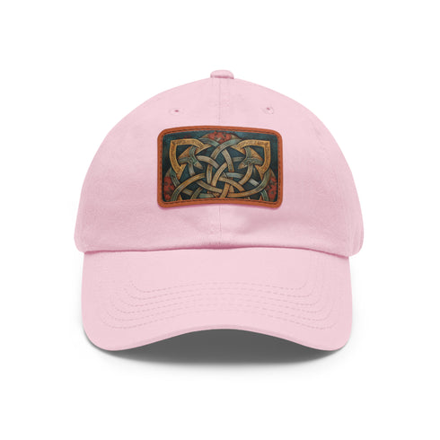 Celtic knot design white baseball hat with light brown patch.